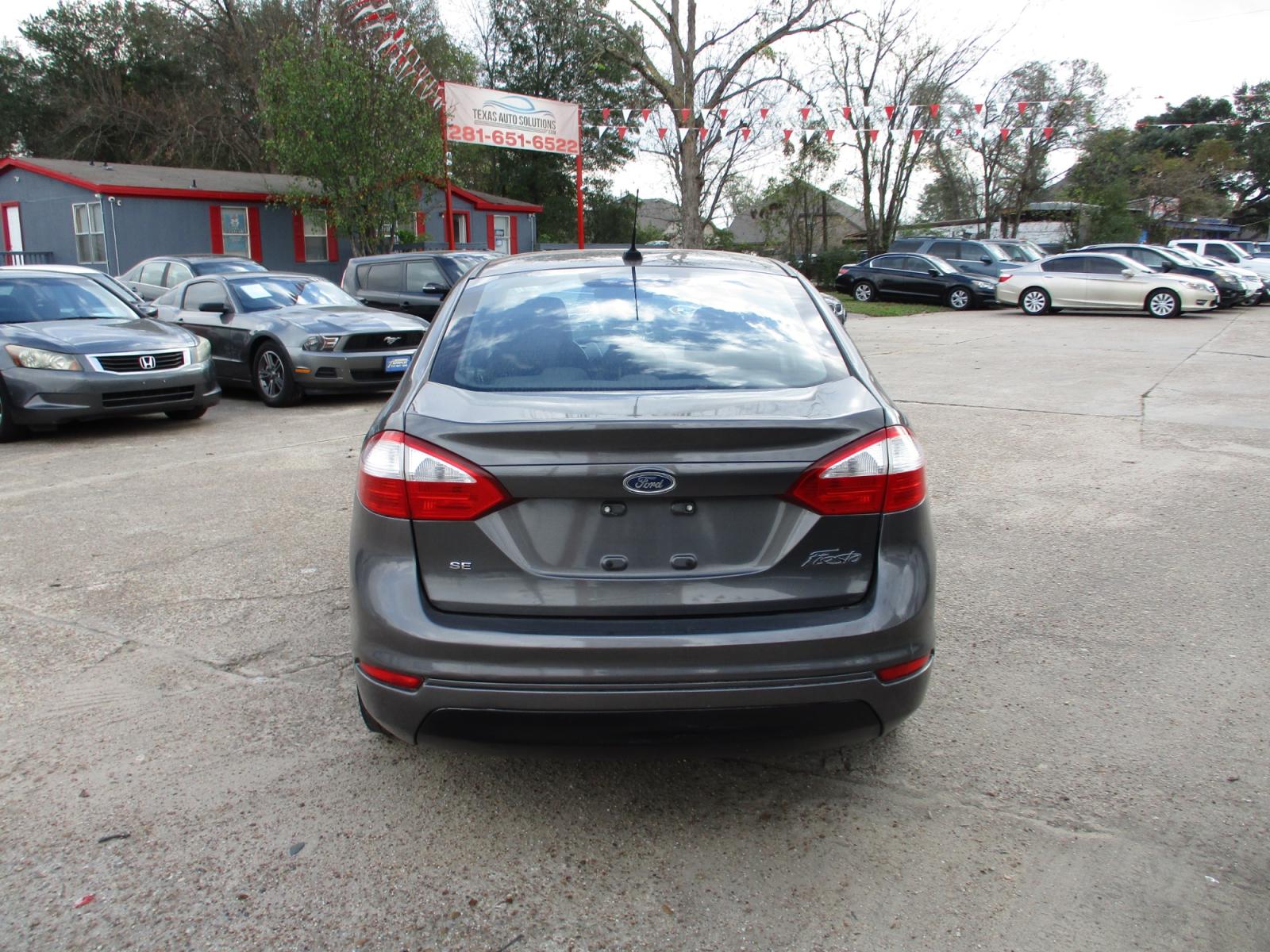 2015 GRAY FORD FIESTA SE Sedan (3FADP4BJ5FM) with an 1.6L L4 DOHC 16V engine, 5-SPEED MANUAL OR 6-SPEED AUTOMATIC transmission, located at 19224 Kuykendahl Rd, Spring, TX, 77379, (713) 947-1245, 30.049259, -95.491402 - It's like a brand new car. You won't believe how tight it drives. Aero-crisp. Sure-footed. Smart. Inspired. This unit has it all, including the admiration of some of the toughest critics in the world. In a single year, Focus was named “Best Car to Buy 2012” by TheCarConnection.com, “One of the - Photo #3