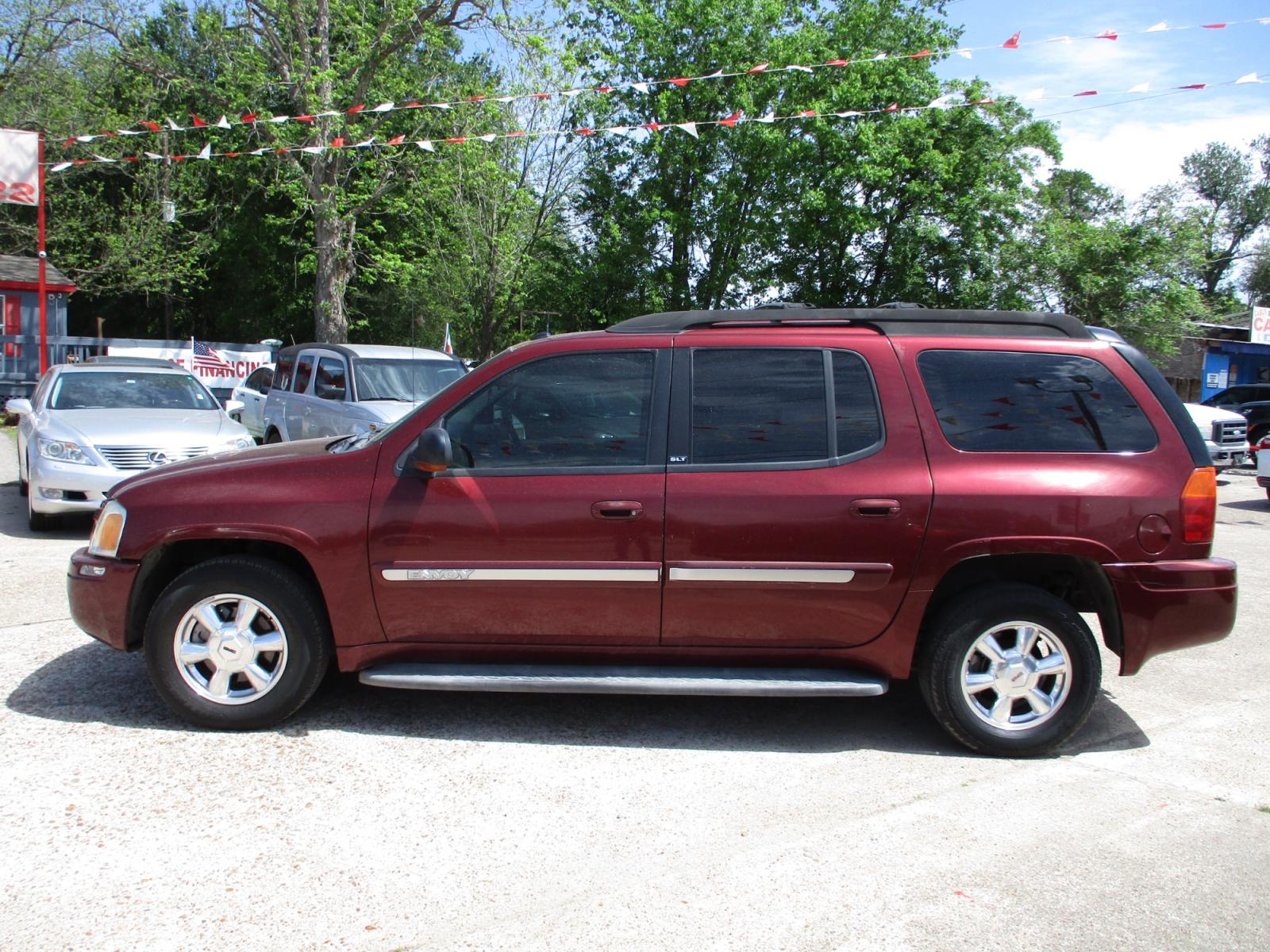2005 RED GMC ENVOY XL SLE 4WD (1GKET16S456) with an 4.2L L6 DOHC 24V engine, 4-SPEED AUTOMATIC transmission, located at 19224 Kuykendahl Rd, Spring, TX, 77379, (713) 947-1245, 30.049259, -95.491402 - This unit has all the strength, power, and security you will ever need in a SUV. The power is a uncompromising Vortec 4200 six-cylinder engine that produces enough horsepower to make this trail blazer one of the most powerful SUV's on the market. It's exemplified in the strength with full-length hyd - Photo #5
