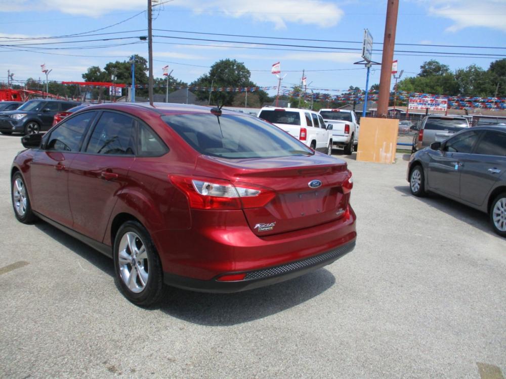 2013 MAROON FORD FOCUS SE Sedan (1FADP3F23DL) with an 2.0L L4 DOHC 16V engine, 5-SPEED MANUAL OR 6-SPEED AUTOMATIC transmission, located at 310 Spencer Hwy, South Houston, TX, 77587, (713) 947-1245, 29.664383, -95.228897 - It's like a brand new car. You won't believe how tight it drives. Aero-crisp. Sure-footed. Smart. Inspired. This unit has it all, including the admiration of some of the toughest critics in the world. In a single year, Focus was named “Best Car to Buy 2012” by TheCarConnection.com, “One of the - Photo #4