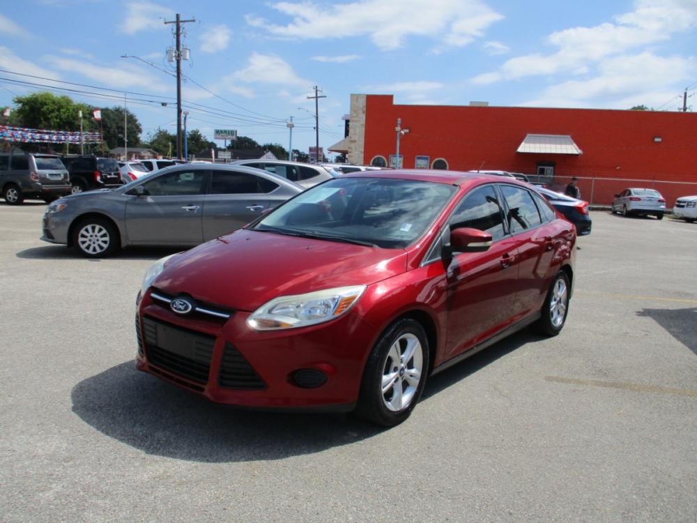 2013 MAROON FORD FOCUS SE Sedan (1FADP3F23DL) with an 2.0L L4 DOHC 16V engine, 5-SPEED MANUAL OR 6-SPEED AUTOMATIC transmission, located at 310 Spencer Hwy, South Houston, TX, 77587, (713) 947-1245, 29.664383, -95.228897 - It's like a brand new car. You won't believe how tight it drives. Aero-crisp. Sure-footed. Smart. Inspired. This unit has it all, including the admiration of some of the toughest critics in the world. In a single year, Focus was named “Best Car to Buy 2012” by TheCarConnection.com, “One of the - Photo #6