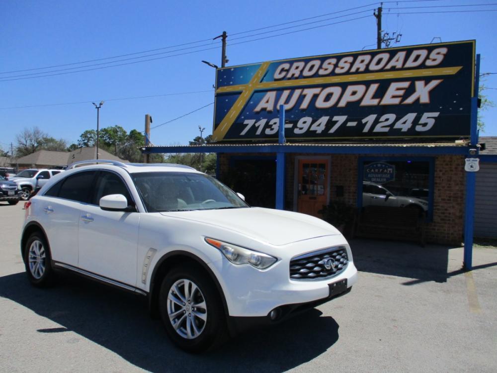 2009 WHITE INFINITI FX FX35 2WD (JNRAS18U19M) with an 3.5L V6 DOHC 24V engine, 5-SPEED AUTOMATIC transmission, located at 310 Spencer Hwy, South Houston, TX, 77587, (713) 947-1245, 29.664383, -95.228897 - Wow, look at this clean unit. This front engine with All Wheel Drive has 275-hp with a 3.5 valve aluminum-alloy V6 engine. The continuously Variable Valve Timing Control System is revolutionary for it's time. Has a 5-speed automatic transmission with a manual shift option for the sport enthusiast. H - Photo #0