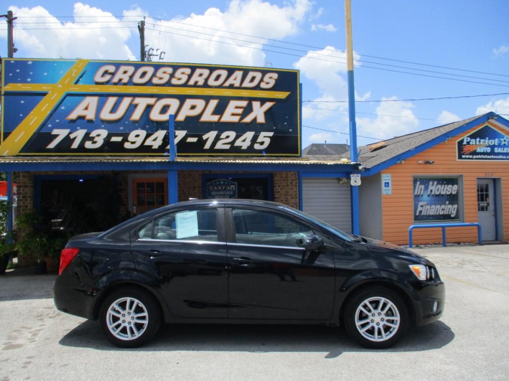 2012 BLACK CHEVROLET SONIC 2LT Sedan (1G1JC5SH9C4) with an 1.8L L4 DOHC 24V engine, 6-SPEED AUTOMATIC transmission, located at 310 Spencer Hwy, South Houston, TX, 77587, (713) 947-1245, 29.664383, -95.228897 - Photo #1