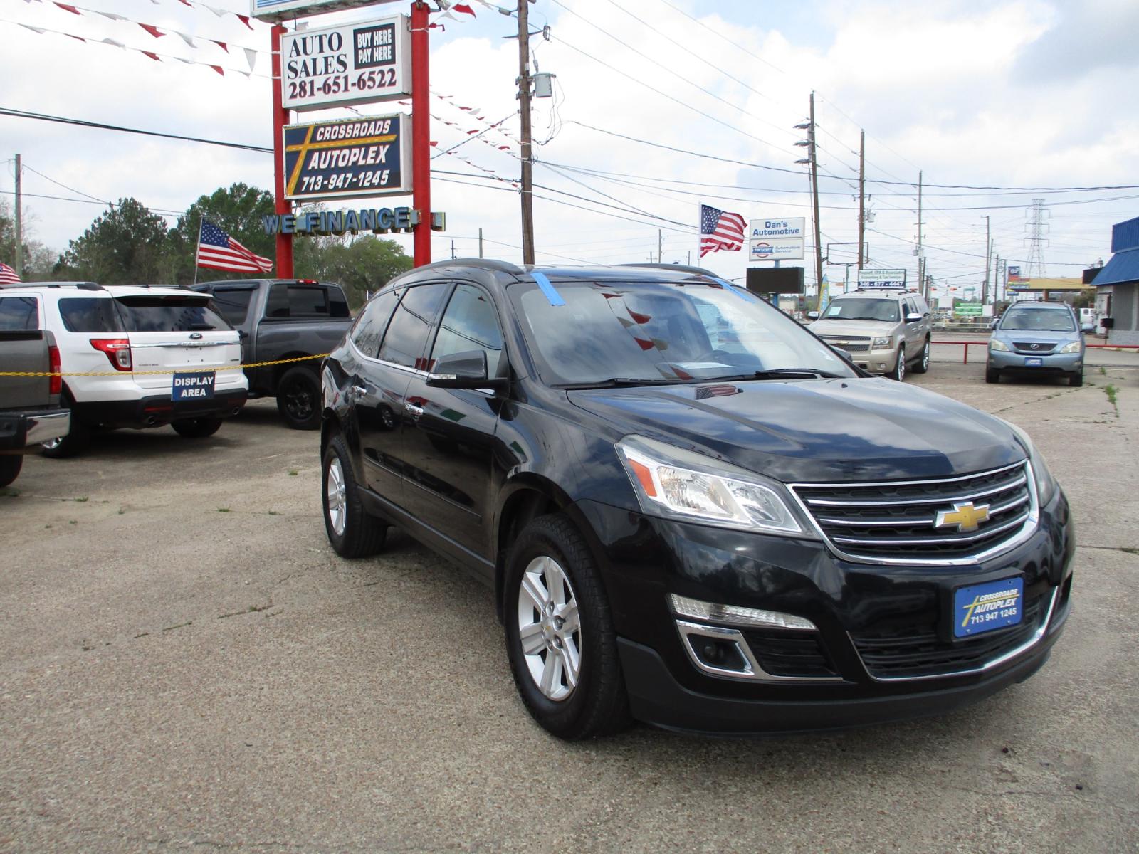 2014 BLACK CHEVROLET TRAVERSE 1LT FWD (1GNKRGKD6EJ) with an 3.6L V6 DOHC 24V engine, 6-SPEED AUTOMATIC transmission, located at 19224 Kuykendahl Rd, Spring, TX, 77379, (713) 947-1245, 30.049259, -95.491402 - This 2014 Chevrolet Traverse is the complete package! It brings the SUV fan and luxury together as one! Today Chevrolet lets you have luxury without having to sacrifice your space! This mid-size SUV has great appeal and will not last long! Come check us out today! Crossroads Autoplex is a family run - Photo #0